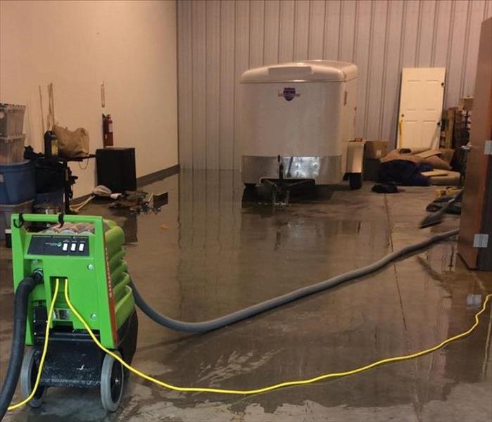 water removing equipment in a large room
