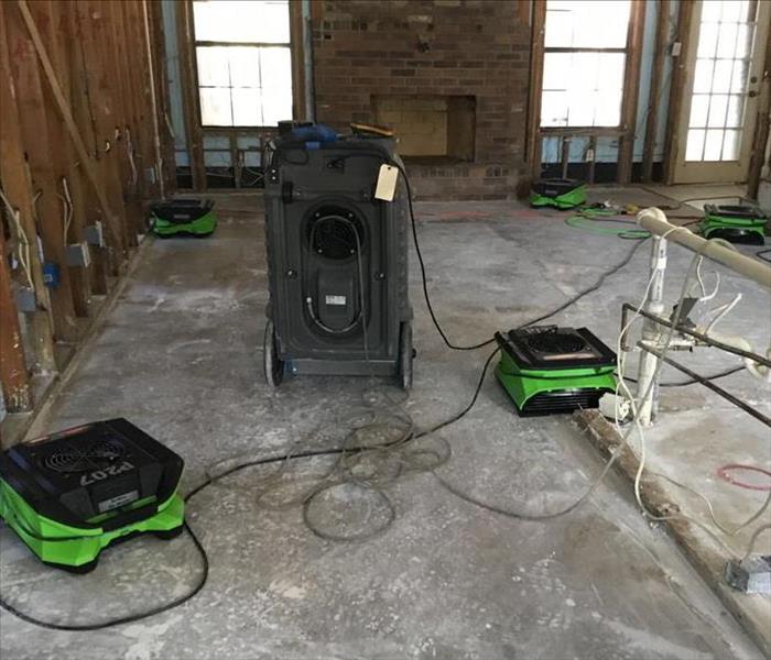 SERVPRO equipment drying out a cement floor