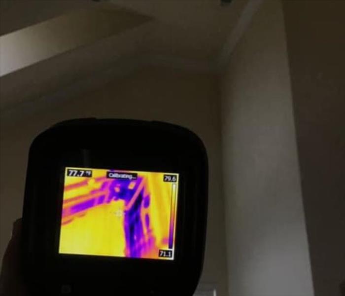 Water damage shown at a residential property through a thermal camera