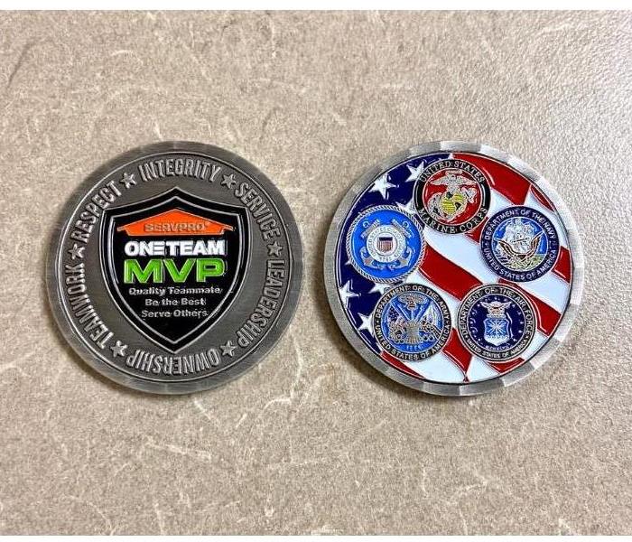 SERVPRO military challenge coin with all 5 branches of the military shown